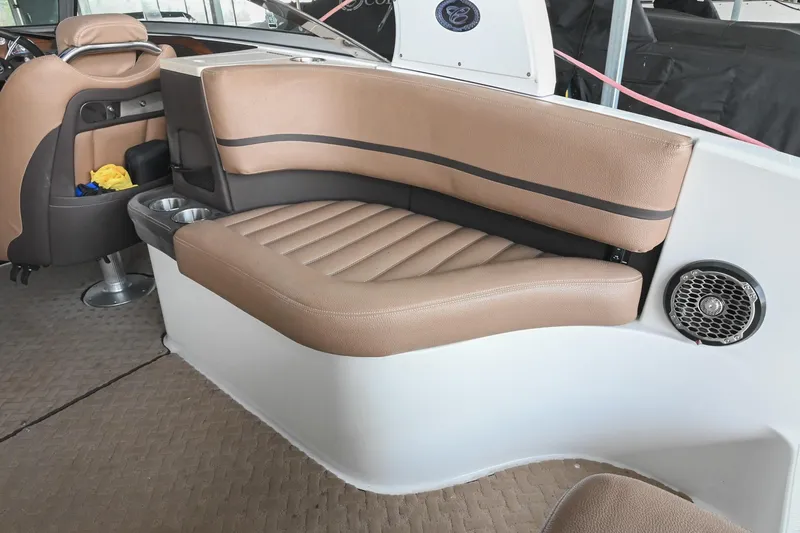Slide: The Image of 2015 Cobalt R7 boat interior with tan leather seating and speaker system. - 10