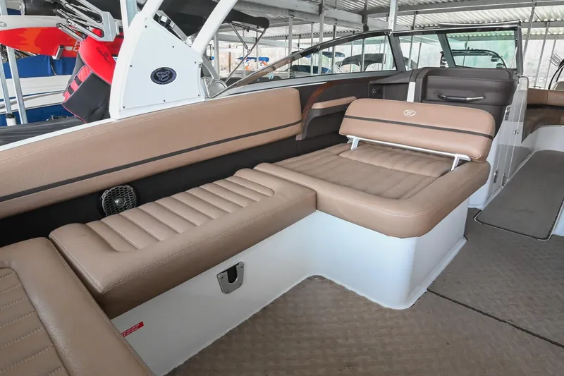 Slide: The Image of 2015 Cobalt R7 boat interior with tan leather seating and modern design. - 13