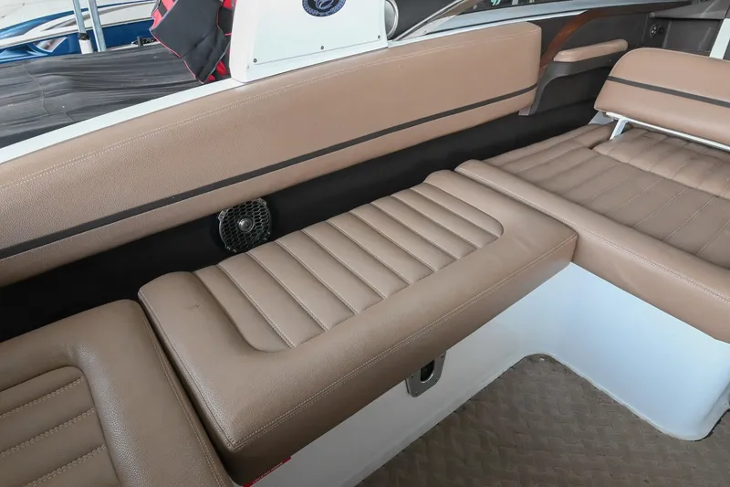 Slide: The Image of 2015 Cobalt R7 boat interior with tan leather seating and speaker detail. - 15