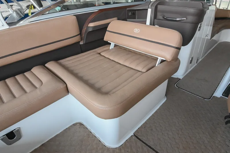 Slide: The Image of 2015 Cobalt R7 boat interior with tan leather seating and modern design. - 18