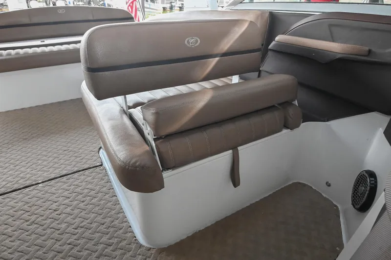 Slide: The Image of 2015 Cobalt R7 boat interior with brown leather seating and carpeted flooring. - 24