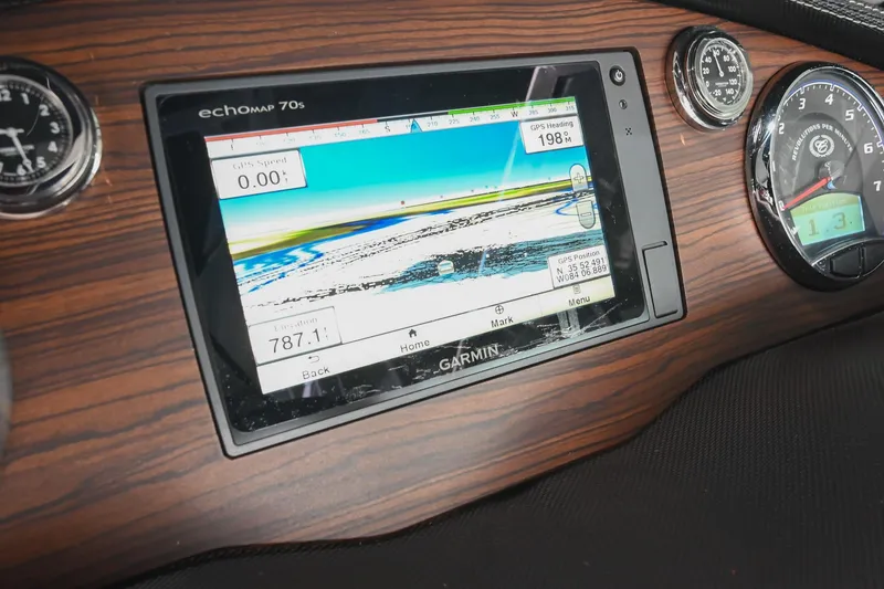 Slide: The Image of Garmin GPS display on 2015 Cobalt R7 dashboard with wood finish. - 31