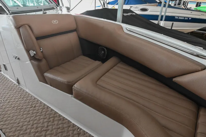 Slide: The Image of 2015 Cobalt R7 boat interior with brown leather seating and carpeted flooring. - 37