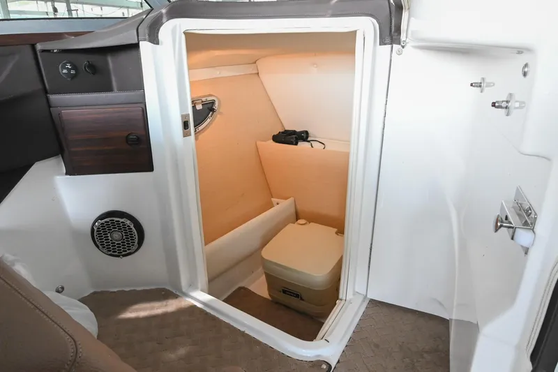 Slide: The Image of Interior of a 2015 Cobalt R7 boat featuring a compact cabin space. - 41