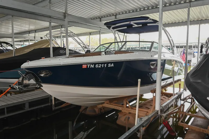 Slide: The Image of 2015 Cobalt R7 boat docked in covered marina, side view. - 47