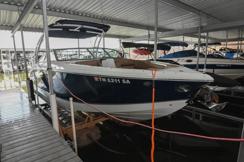 Slide: The Image of 2015 Cobalt R7 boat docked in covered marina, side view. - 48