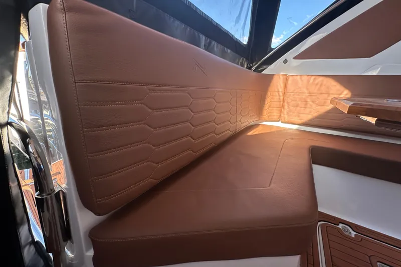 Slide: The Image of Luxurious brown leather seating on 2025 NX Boats 370, featuring elegant stitching and modern design. - 110