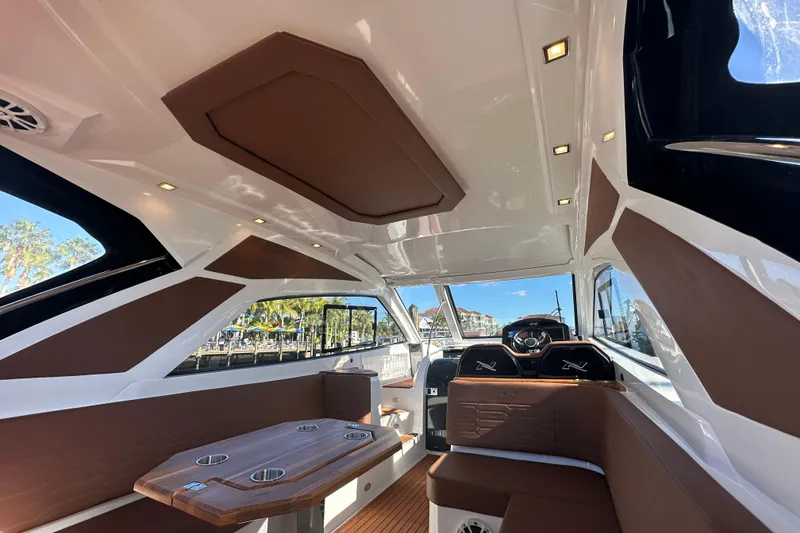 Slide: The Image of Interior of 2025 NX Boats 370, featuring sleek design and luxurious seating. - 14