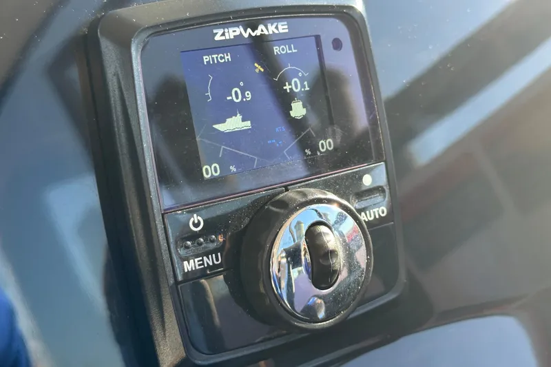 Slide: The Image of Zipwake control panel on 2025 NX Boats 370, displaying pitch and roll data. - 41