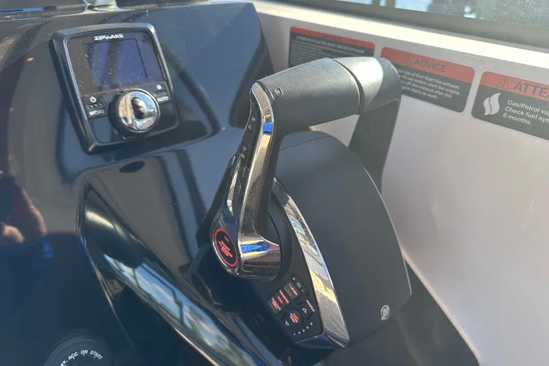 Slide: The Image of Throttle control and display panel of 2025 NX Boats 370, featuring modern navigation technology. - 42