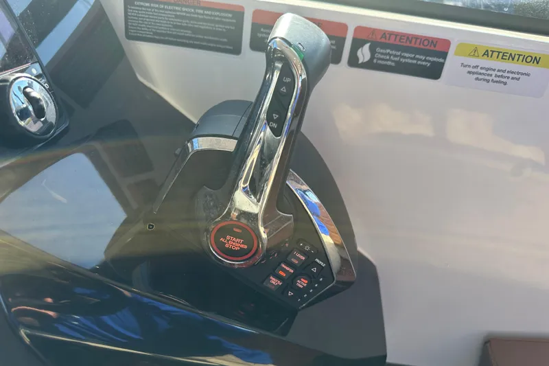 Slide: The Image of Throttle control panel of 2025 NX Boats 370 with safety warnings. - 43