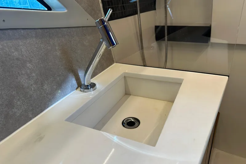 Slide: The Image of Modern sink and faucet in 2025 NX Boats 370 interior. - 57