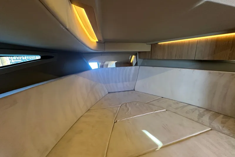 Slide: The Image of Luxurious interior cabin of 2025 NX Boats 370 with ambient lighting and plush seating. - 63