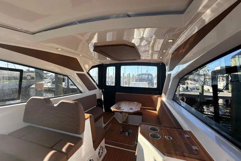 Slide: The Image of Interior of 2025 NX Boats 370, featuring sleek design and comfortable seating. - 98