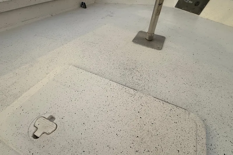 Slide: The Image of 2019 G3 Bay 22 DLX boat interior with seating, docked by a serene lake. - 15