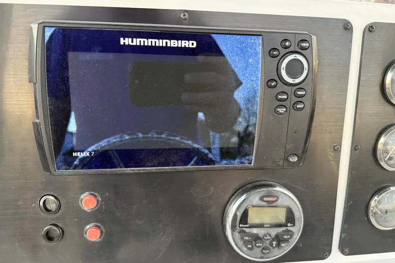 Slide: The Image of 2019 G3 Bay 22 DLX boat on trailer with Yamaha outboard motor. - 21