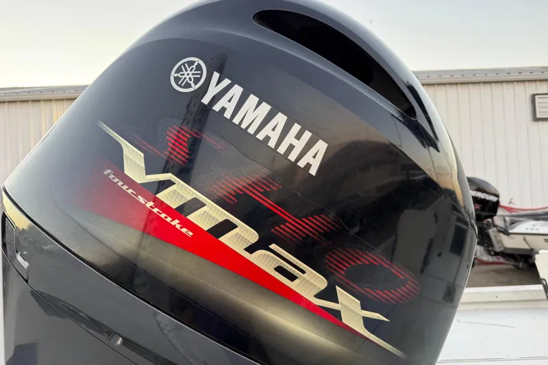 Slide: The Image of 2019 G3 Bay 22 DLX boat on trailer at sunset by the water. - 24