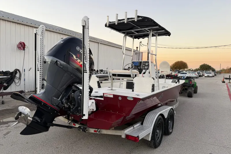 Slide: The Image of 2019 G3 Bay 22 DLX boat on trailer, featuring a 175 HP outboard motor. - 32