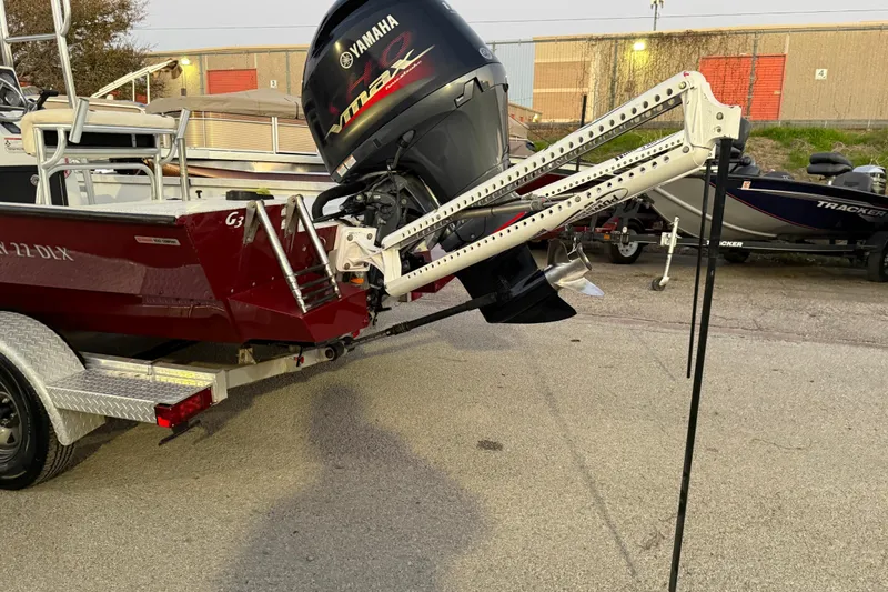 Slide: The Image of 2019 G3 Bay 22 DLX boat on trailer by waterfront at sunset. - 7