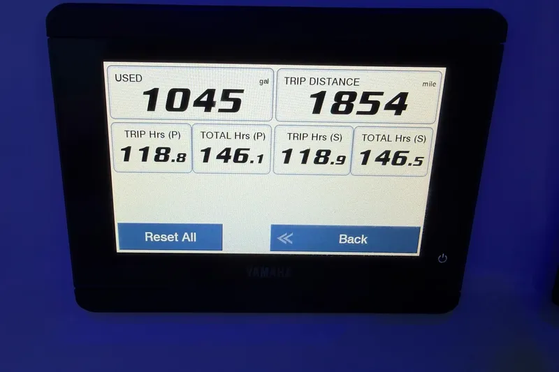 Slide: The Image of Display screen showing fuel usage and trip data for 2023 Cobia 262 Center Console. - 12