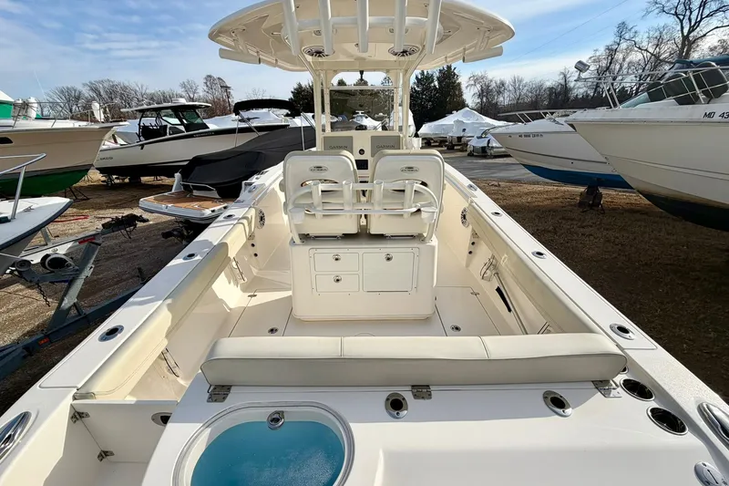 Slide: The Image of 2023 Cobia 262 Center Console boat with spacious seating and modern design. - 14