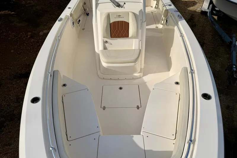 Slide: The Image of 2023 Cobia 262 Center Console boat interior with seating and storage compartments. - 18