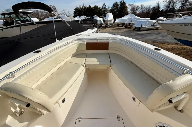 Slide: The Image of 2023 Cobia 262 Center Console boat interior with spacious seating and sleek design. - 20