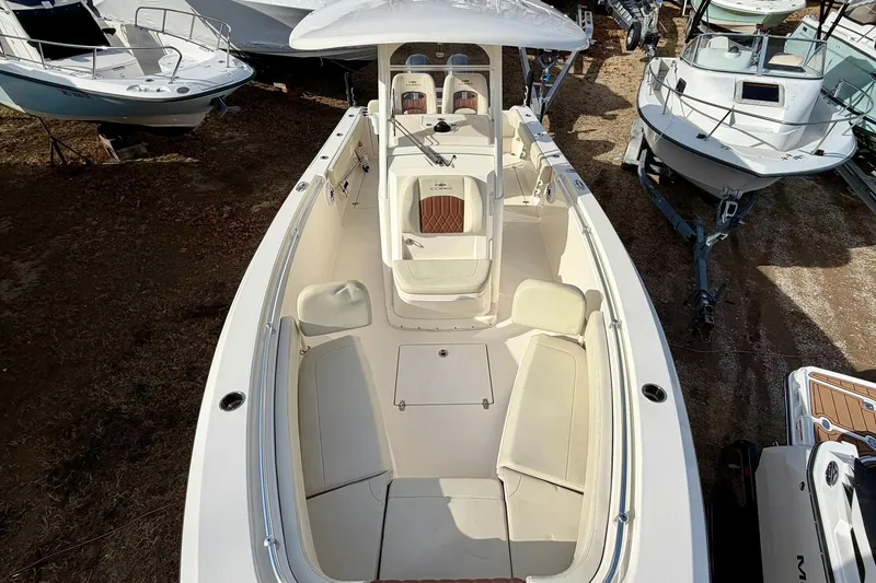 Slide: The Image of 2023 Cobia 262 Center Console boat with spacious seating and sleek design. - 22