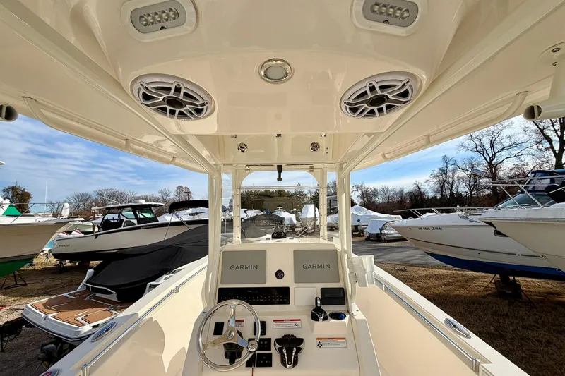 Slide: The Image of 2023 Cobia 262 Center Console boat interior with Garmin navigation system. - 25