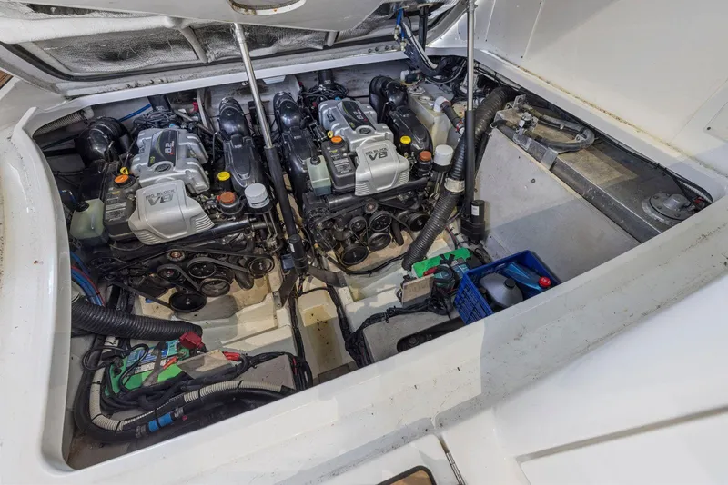 Slide: The Image of Engine compartment of a 2014 Sea Ray 350 Sundancer with dual V8 engines. - 33