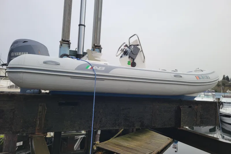 Slide: The Image of 2014 AB Inflatables Oceanus 15 VST boat on lift with Yamaha engine. - 15