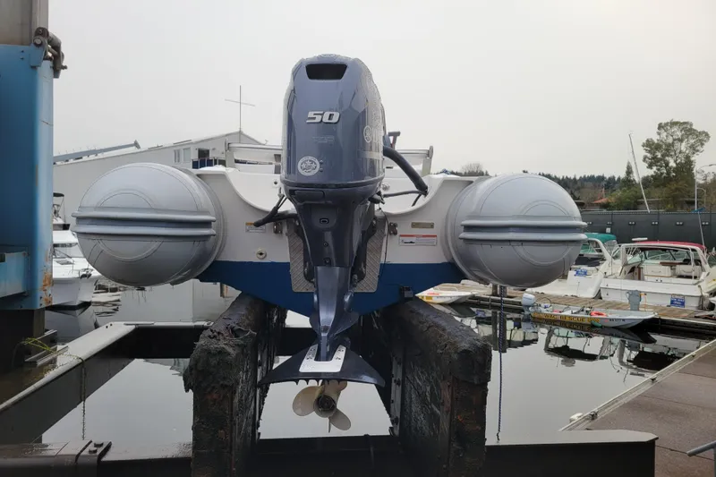 Slide: The Image of 2014 AB Inflatables Oceanus 15 VST boat with outboard motor at marina. - 17