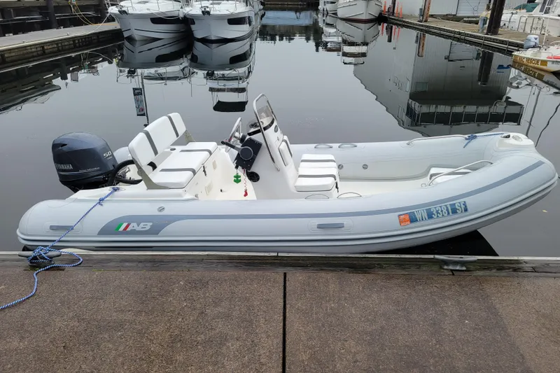 Slide: The Image of 2014 AB Inflatables Oceanus 15 VST boat docked, featuring Yamaha outboard motor. - 3