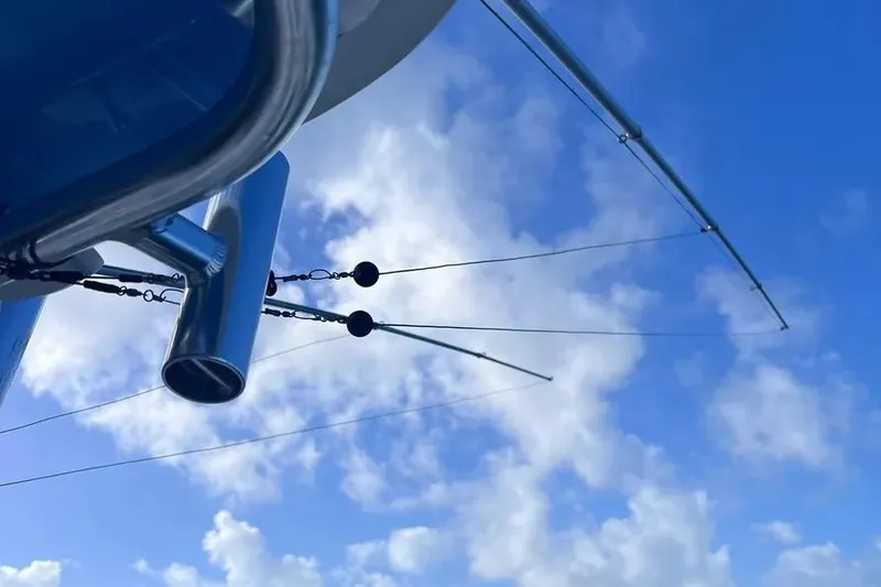 Slide: The Image of Outriggers on a 2024 Contender 30 Tournament boat against a blue sky. - 12