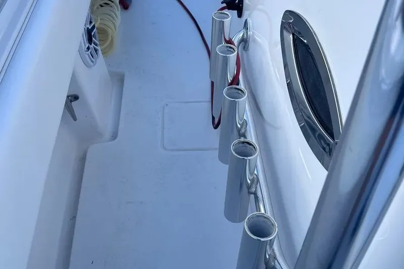 Slide: The Image of 2024 Contender 30 Tournament boat deck with rod holders and speaker. - 15