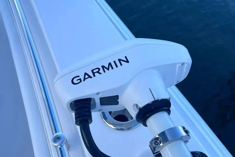 Slide: The Image of Garmin device on 2024 Contender 30 Tournament boat, mounted near water. - 19