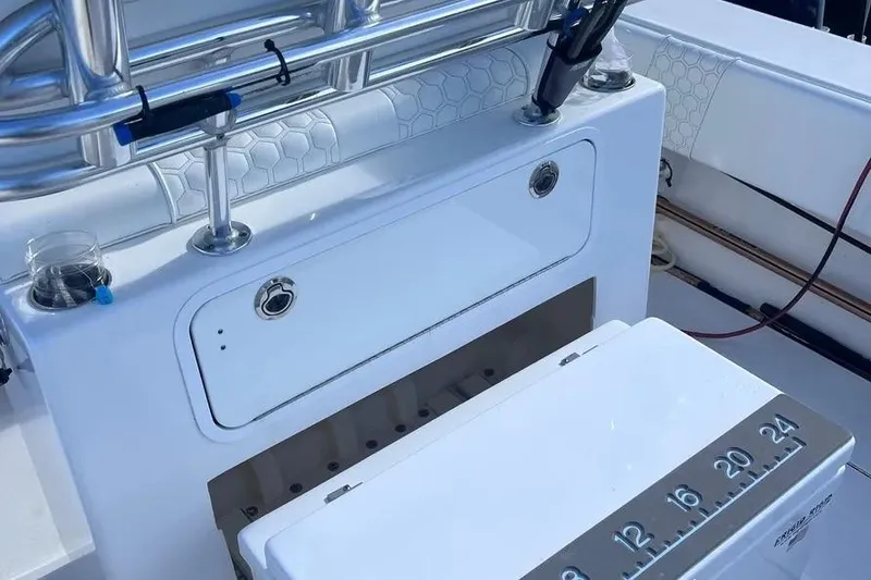 Slide: The Image of 2024 Contender 30 Tournament boat with fishing rod holders and measuring board. - 23