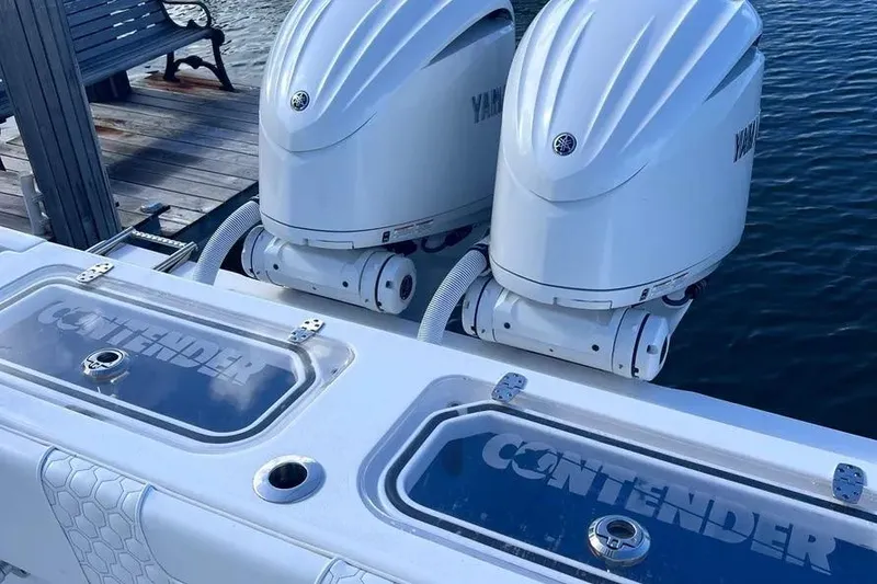 Slide: The Image of 2024 Contender 30 Tournament boat with dual Yamaha outboard engines at dock. - 24