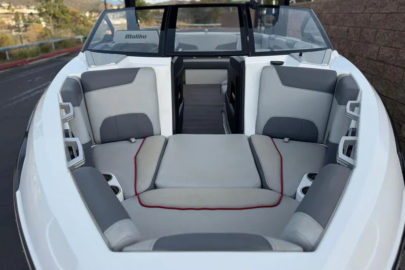 Slide: The Image of 2020 Malibu Wakesetter 22 LSV boat interior with gray seating and cup holders. - 16