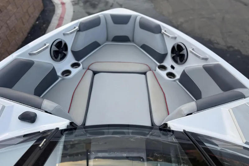 Slide: The Image of 2020 Malibu Wakesetter 22 LSV boat interior with cushioned seating and speakers. - 17