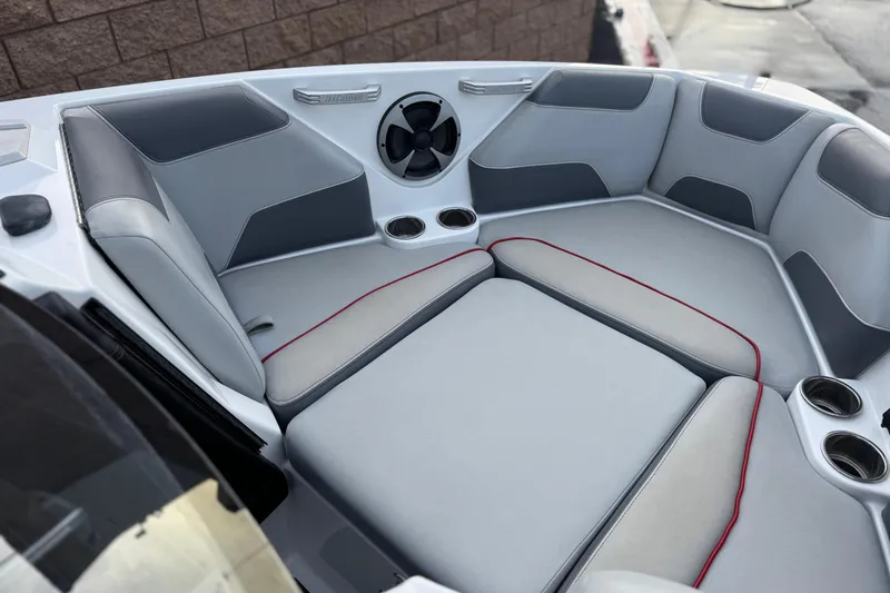 Slide: The Image of Interior of 2020 Malibu Wakesetter 22 LSV boat with gray seating and cup holders. - 18