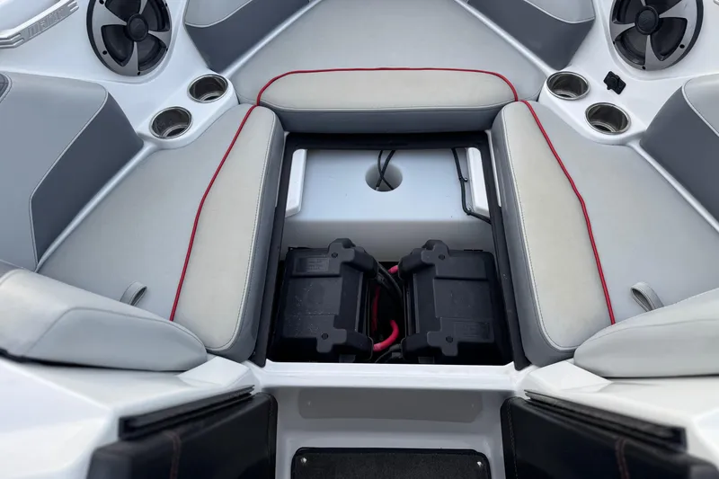 Slide: The Image of 2020 Malibu Wakesetter 22 LSV interior with seating and battery compartment. - 20