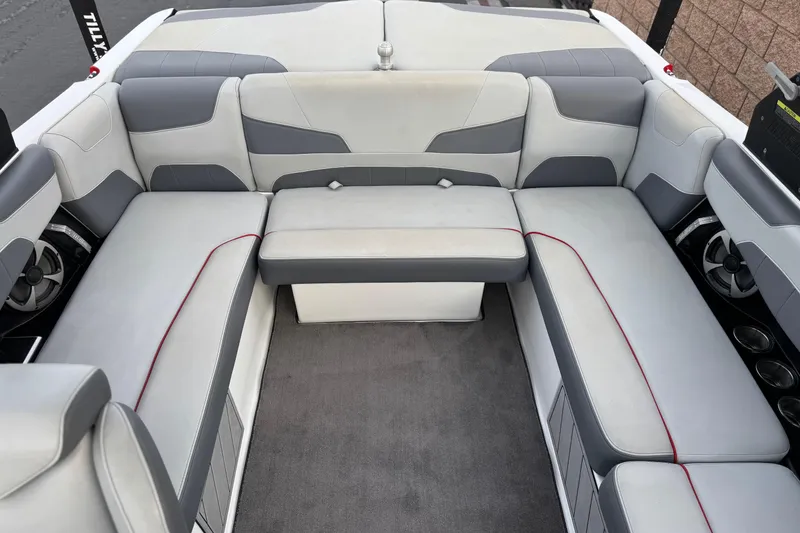 Slide: The Image of 2020 Malibu Wakesetter 22 LSV interior with gray and white seating, red accents. - 22