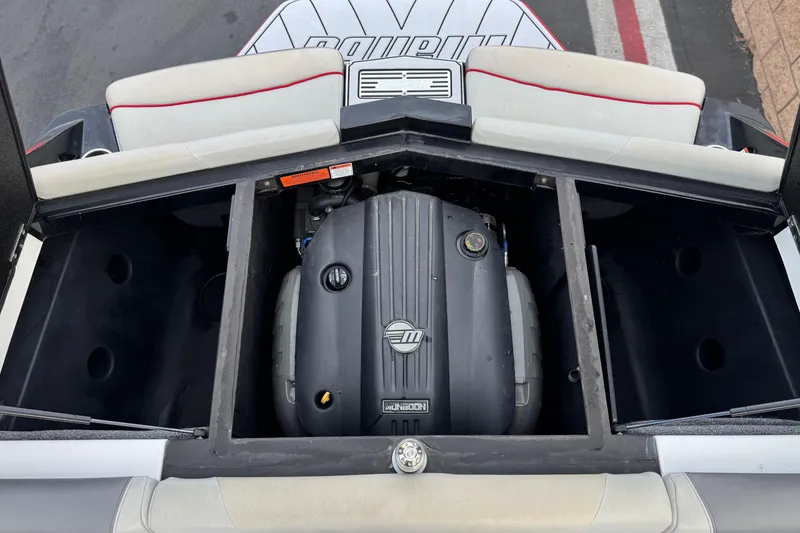 Slide: The Image of 2020 Malibu Wakesetter 22 LSV engine compartment with open storage areas. - 24