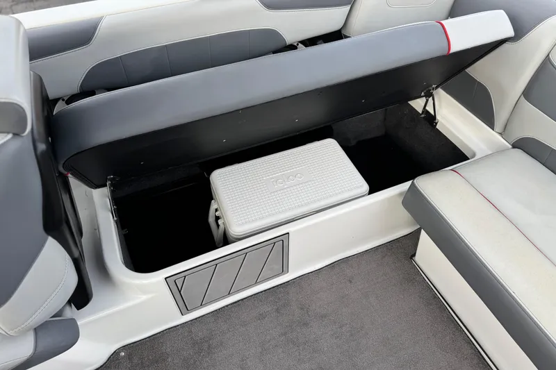 Slide: The Image of 2020 Malibu Wakesetter 22 LSV interior storage with Igloo cooler under seat. - 27