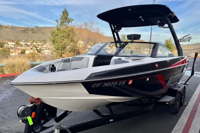 Slide: The Image of 2020 Malibu Wakesetter 22 LSV boat on trailer, scenic background. - 3