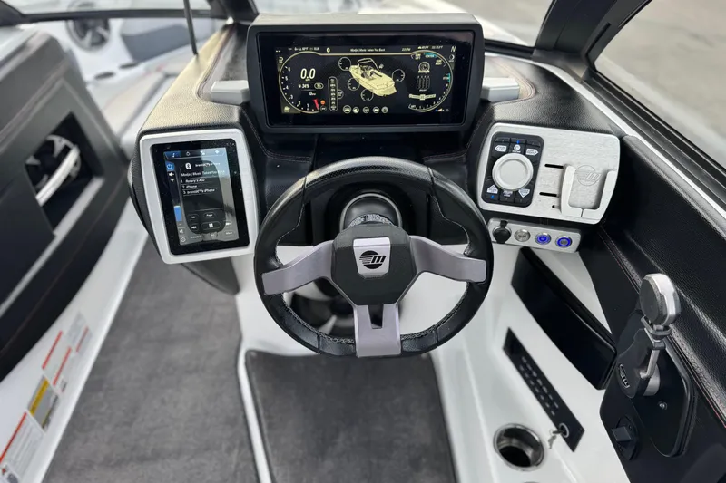 Slide: The Image of 2020 Malibu Wakesetter 22 LSV dashboard with advanced controls and digital displays. - 34