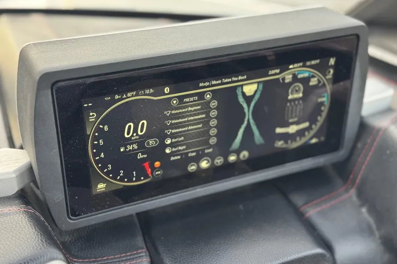 Slide: The Image of Dashboard display of 2020 Malibu Wakesetter 22 LSV showing speed and presets. - 38