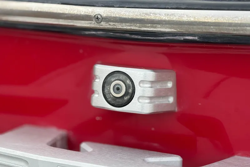 Slide: The Image of Close-up of a 2020 Malibu Wakesetter 22 LSV boat camera on red exterior. - 8