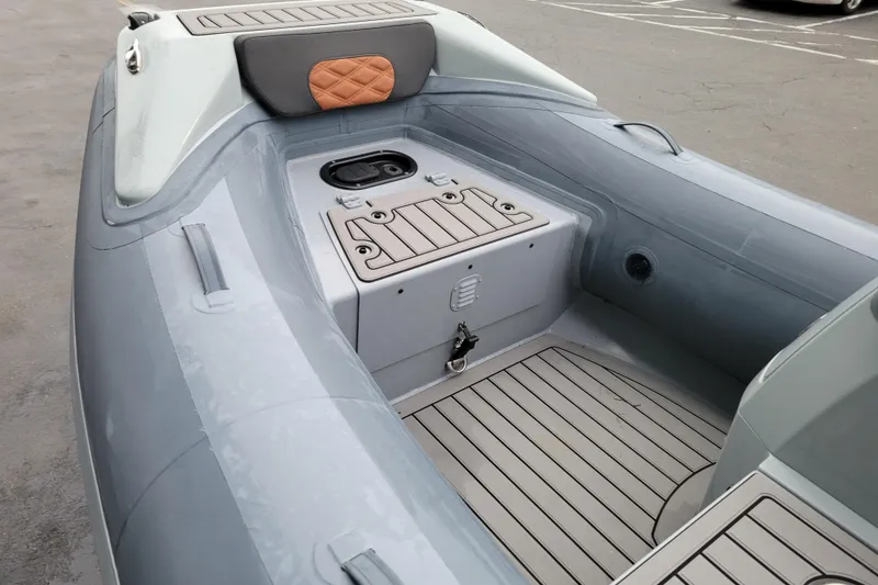 Slide: The Image of 2023 Highfield Sport 360 inflatable boat interior with gray seating and storage compartments. - 10